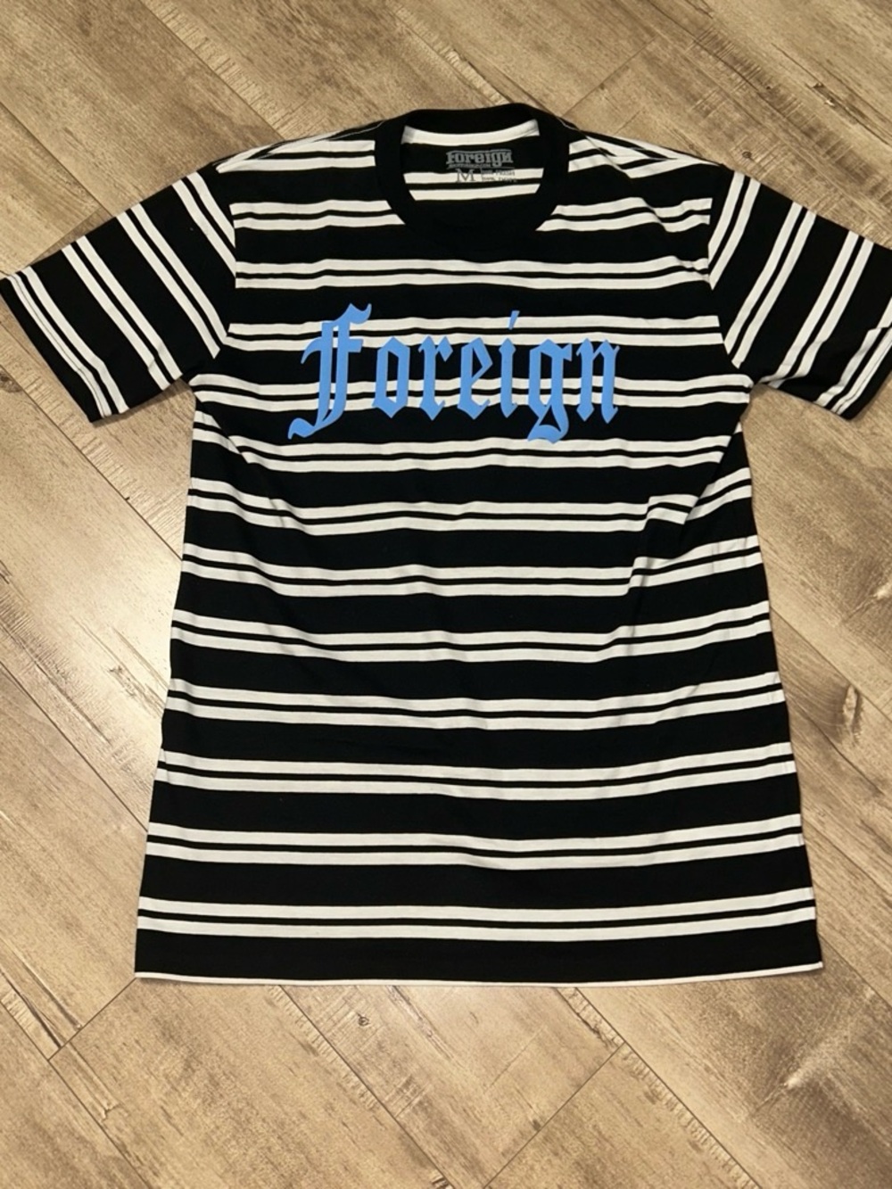 Reign Black & White Striped Tee with Blue Chest Script